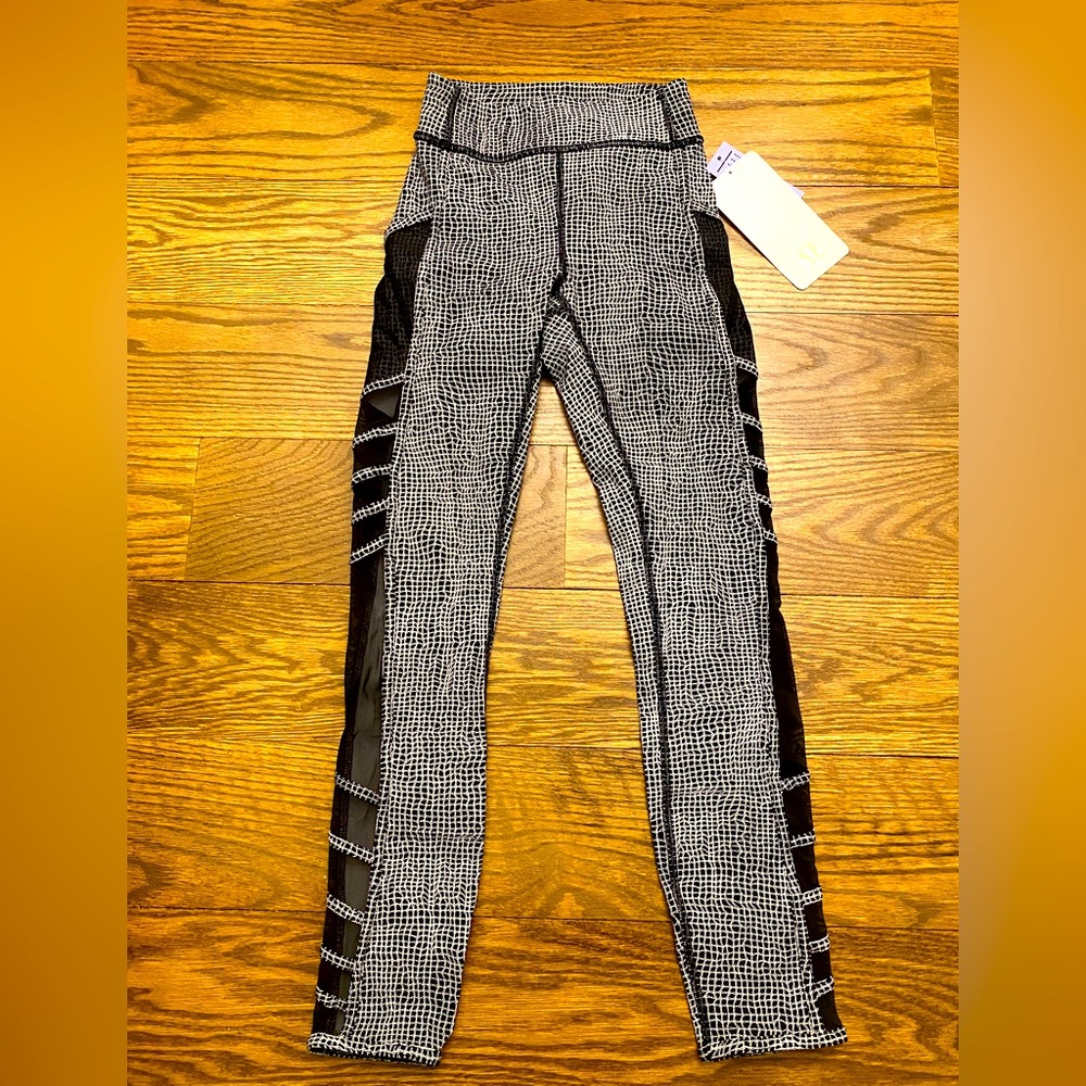 NWT Lululemon “Wild and Free Tight” Leggings, Size 2. Black & white, black mesh